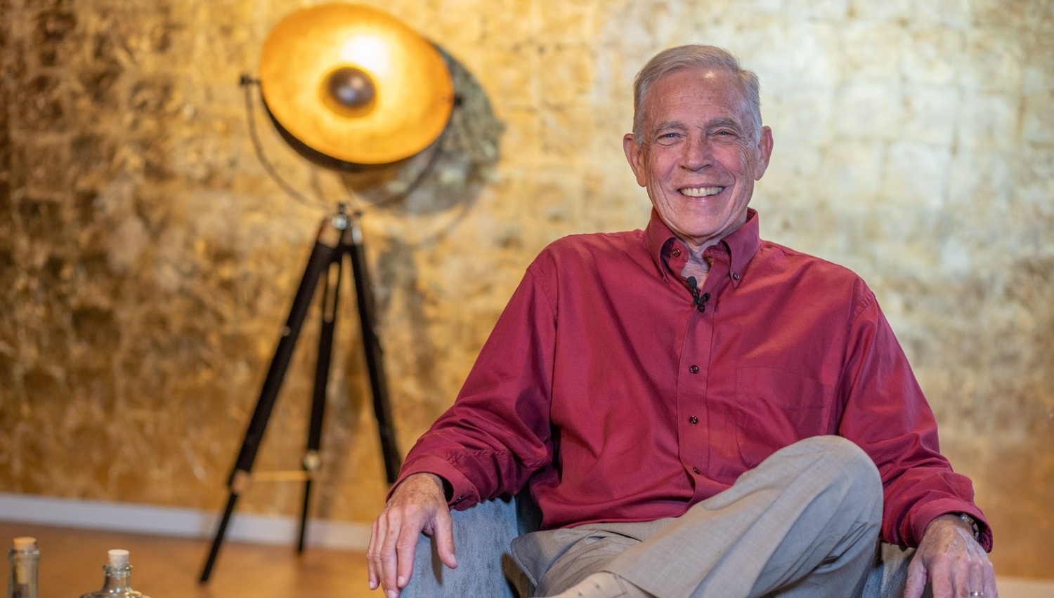 Dr. Frank Kinslow seated, looking relaxed and contemplative